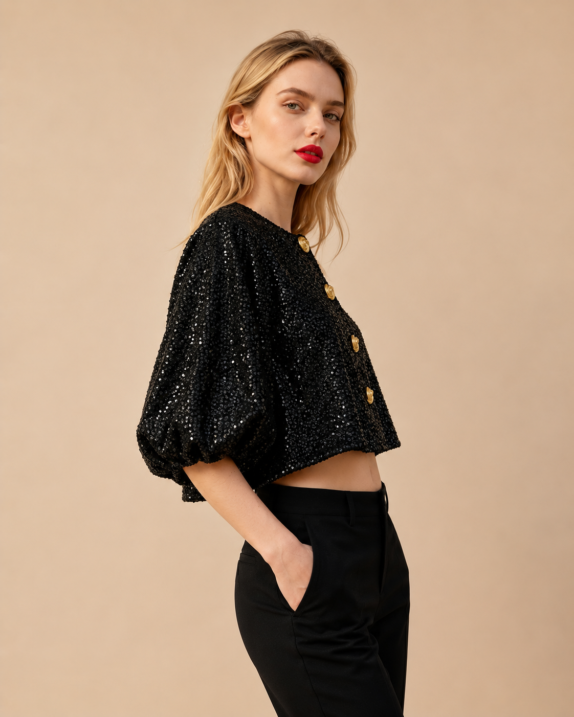 Black sequin cropped top with short balloon sleeves and gold button accents