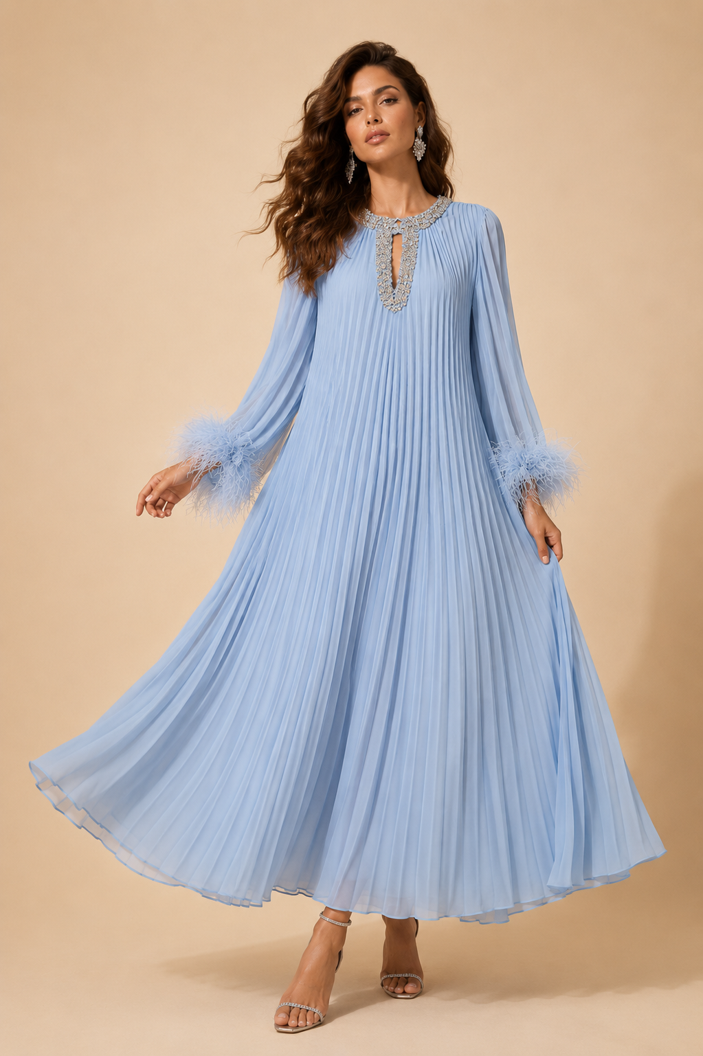 Light blue pleated maxi dress with feather sleeve accents and jeweled V-neck detail