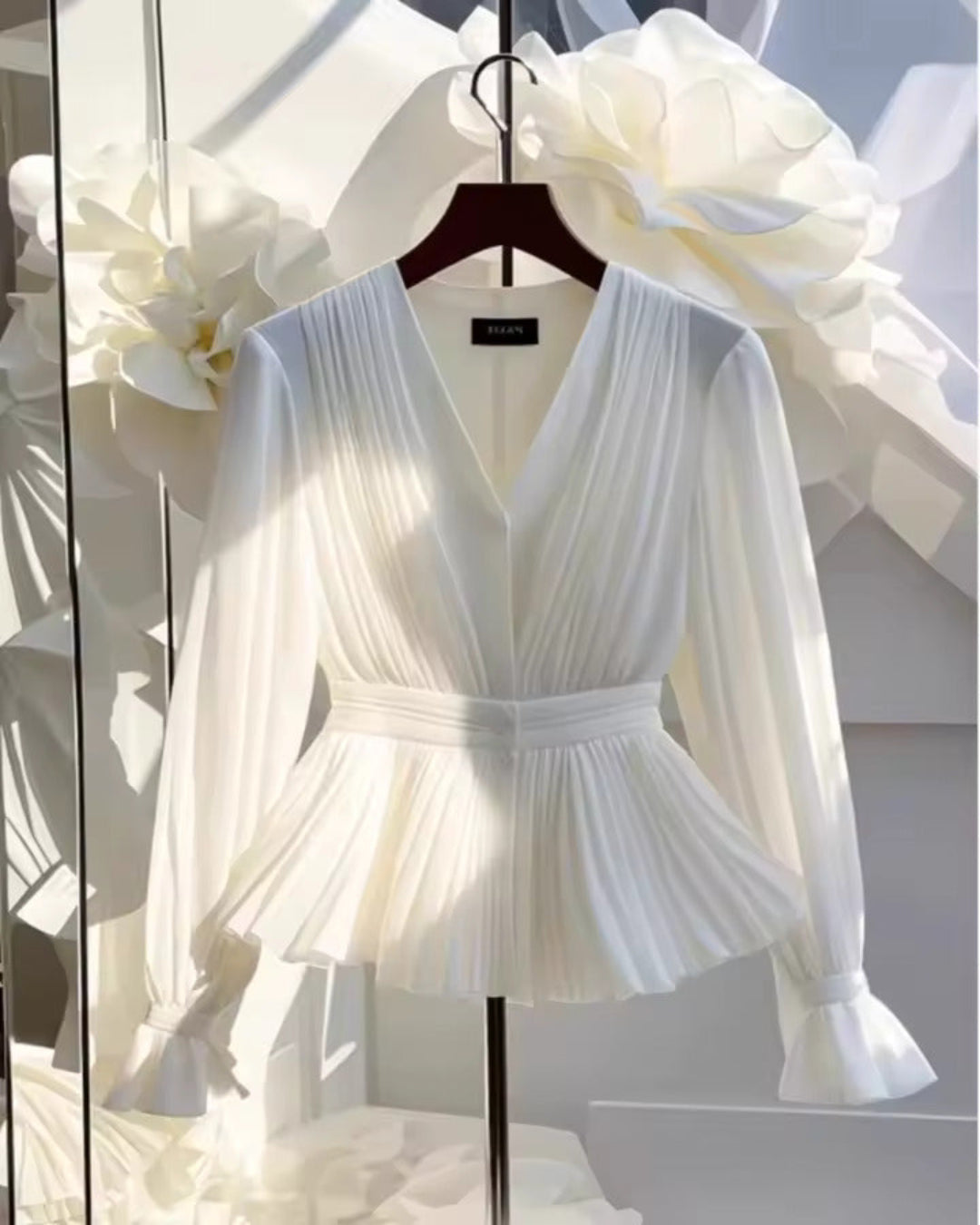 White Pleated Peplum V‑Neck Top