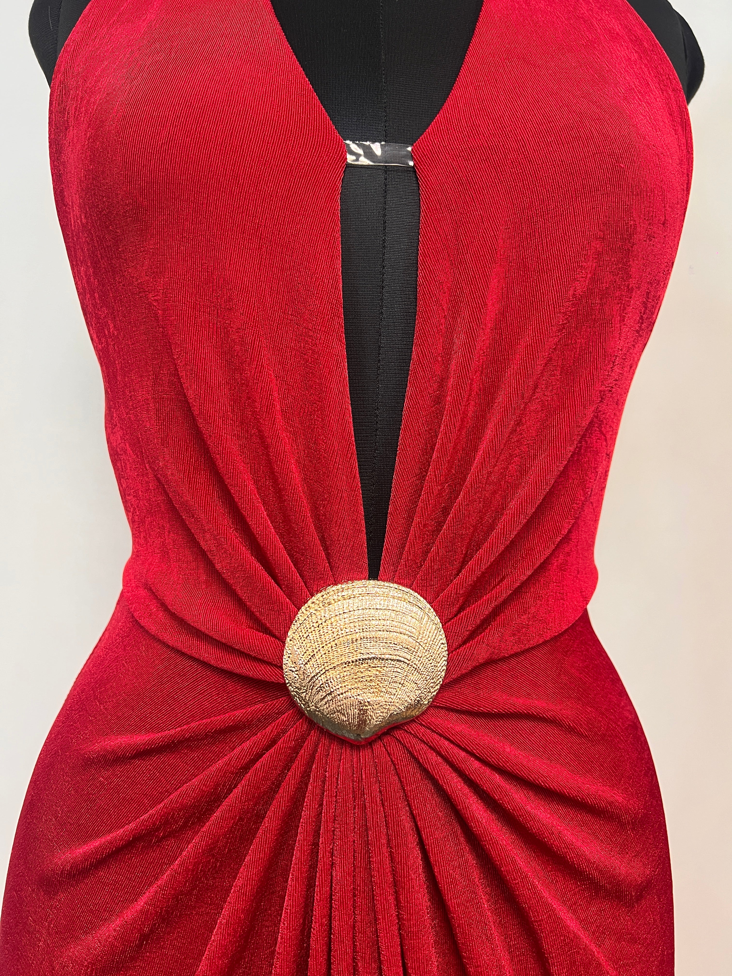 Red V-neck halter gown with black halter band and gold round waist clasp